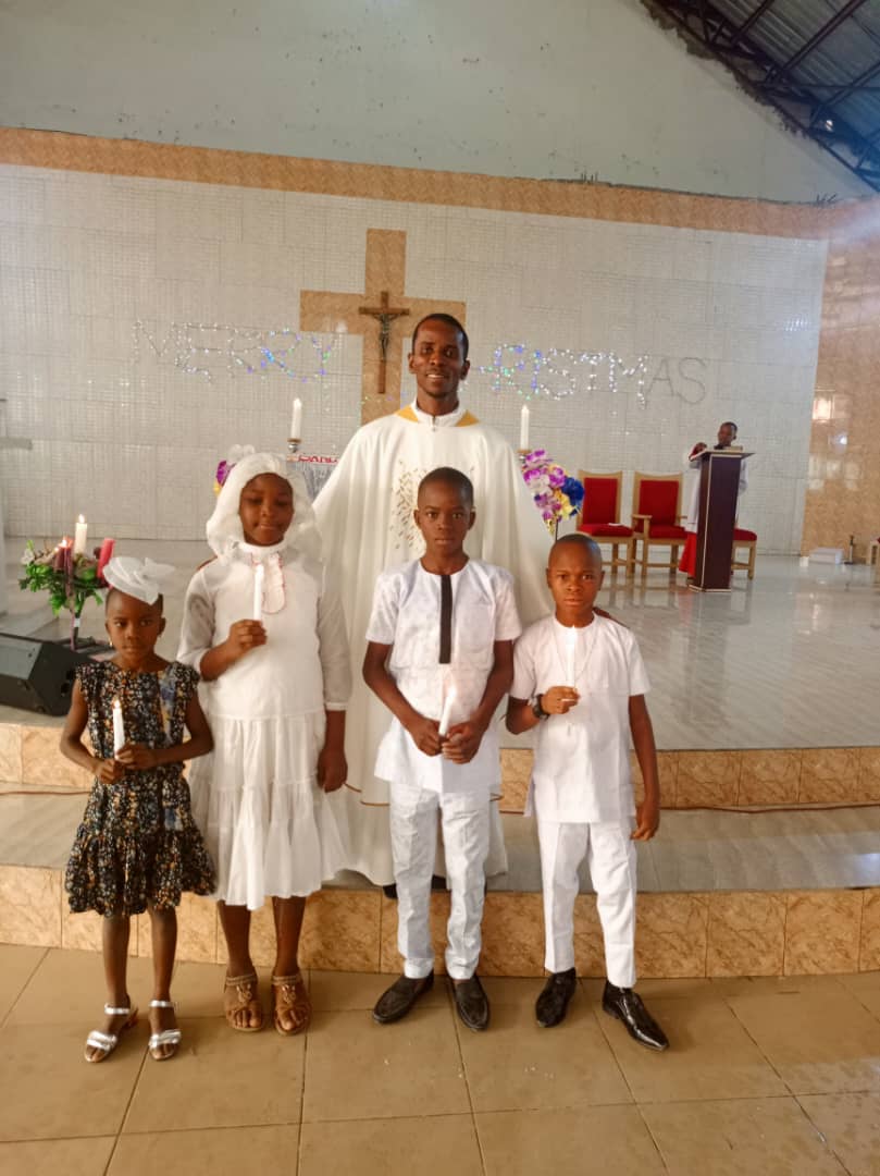 Priest with New Communicants